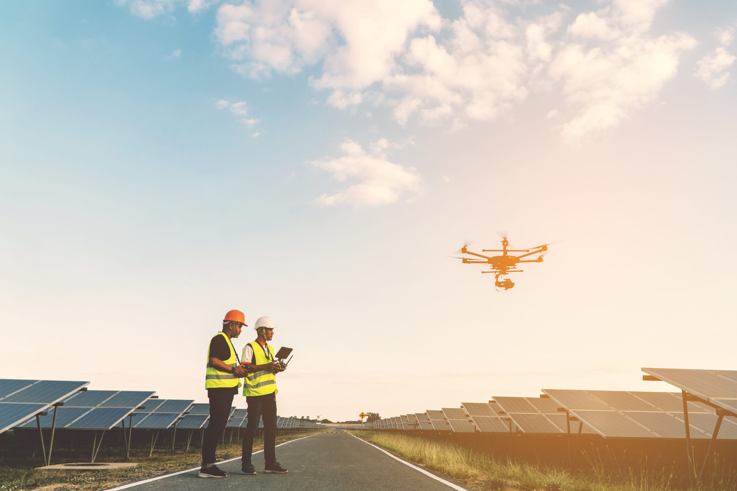 Two pilots performing a drone inspection on a solar site to capture premium datam